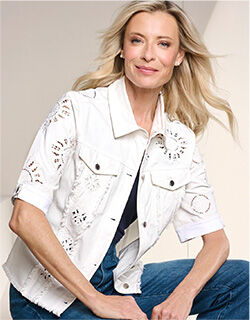 model wearing white short-sleeve jacket with gold embroidery patterns