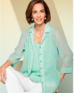 model wearing pale mint green sheer shell shirt over matching blouse