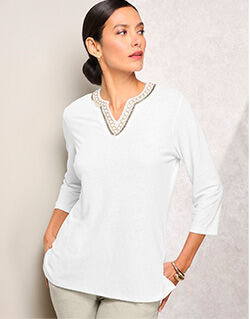 model wearing white 3/4 sleeve tunic