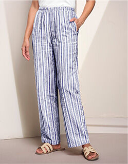 waist-down view of model wearing blue and white striped casual pants