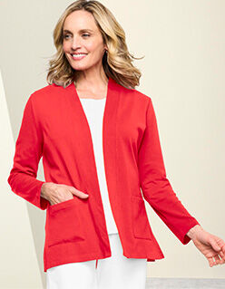 smiling model wearing red sports jacket over white top and pants