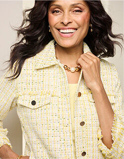 woman wearing pale yellow jacket with matching tee underneath