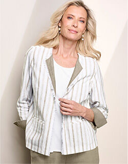 model wearing white jacket with vertical beige stripes, white shirt under, and beige pants