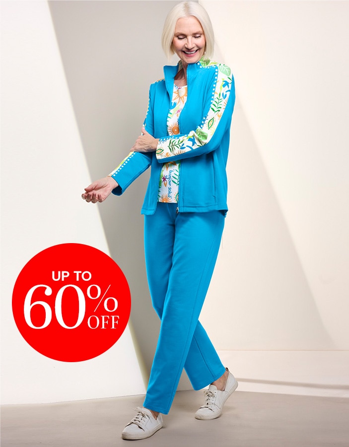 model wearing light blue track suit with white and colored strip pattern down the sleeve, matching t-shirt