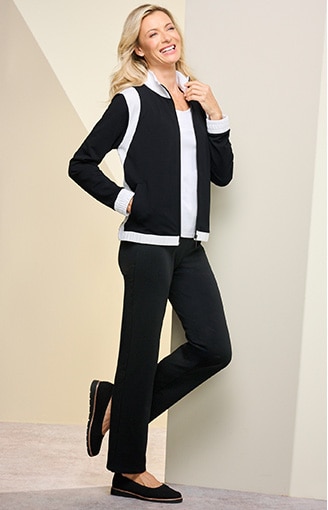 woman wearing black and white track suit