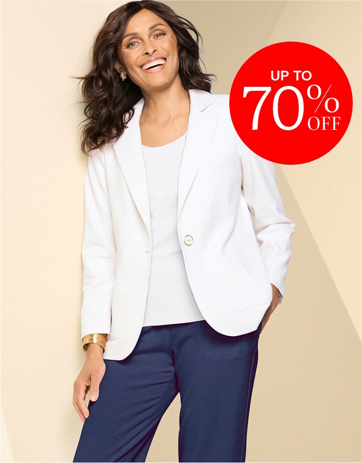 model wearing white jacket with white t-shirt underneath and blue pants