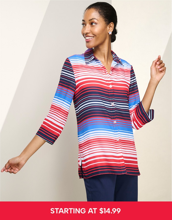 model smiling to the left, wearing a striped top and dark blue pants