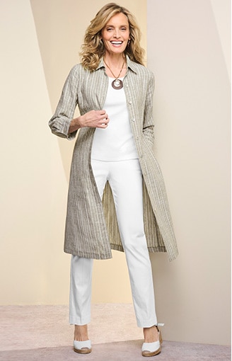 model wearing white shirt, white pants, and 3/4 length light-weight beige jacket